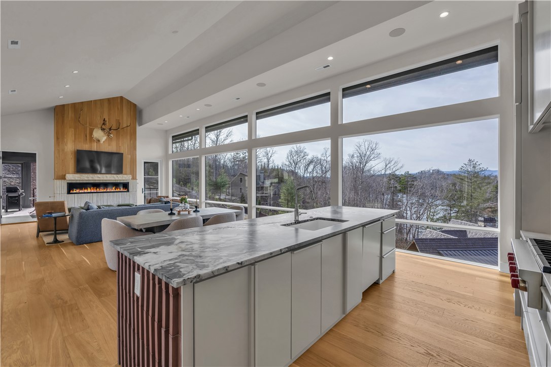 127 Crosswind Court Sunset, SC 29685 - Photo 9 of 49 Bright open-concept living space with a gourmet kitchen and breathtaking outdoor views.
