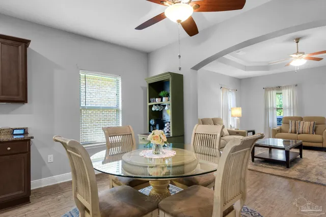 a dining room with furniture and window