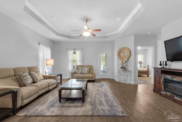 a living room with furniture and a flat screen tv