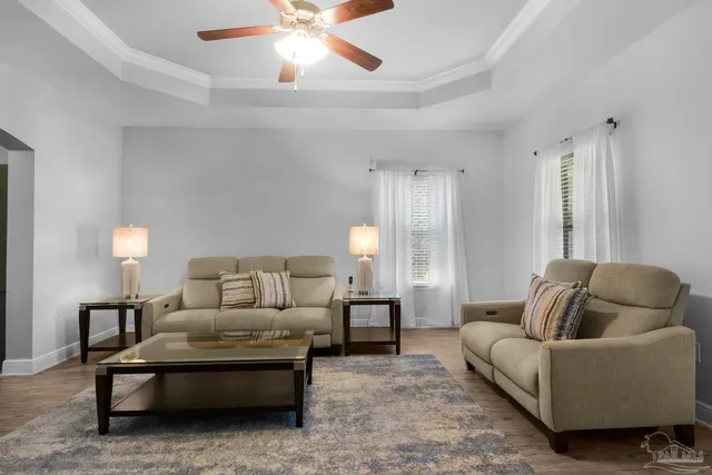 a living room with furniture and a large window