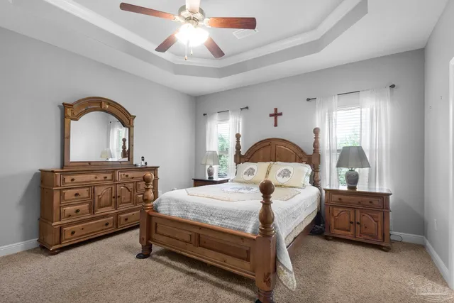 a bedroom with a bed and a dresser