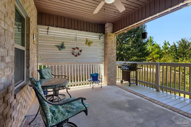 a view of a two chairs in the balcony