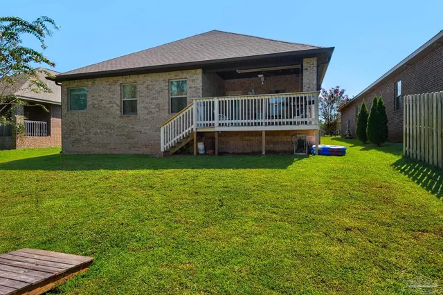 a backyard of a house with lots of green space