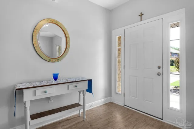 a bathroom with a sink mirror and vanity