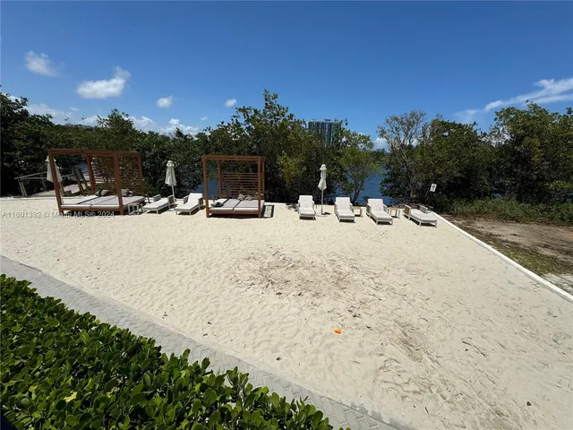 a view of swimming pool with outdoor seating and plants