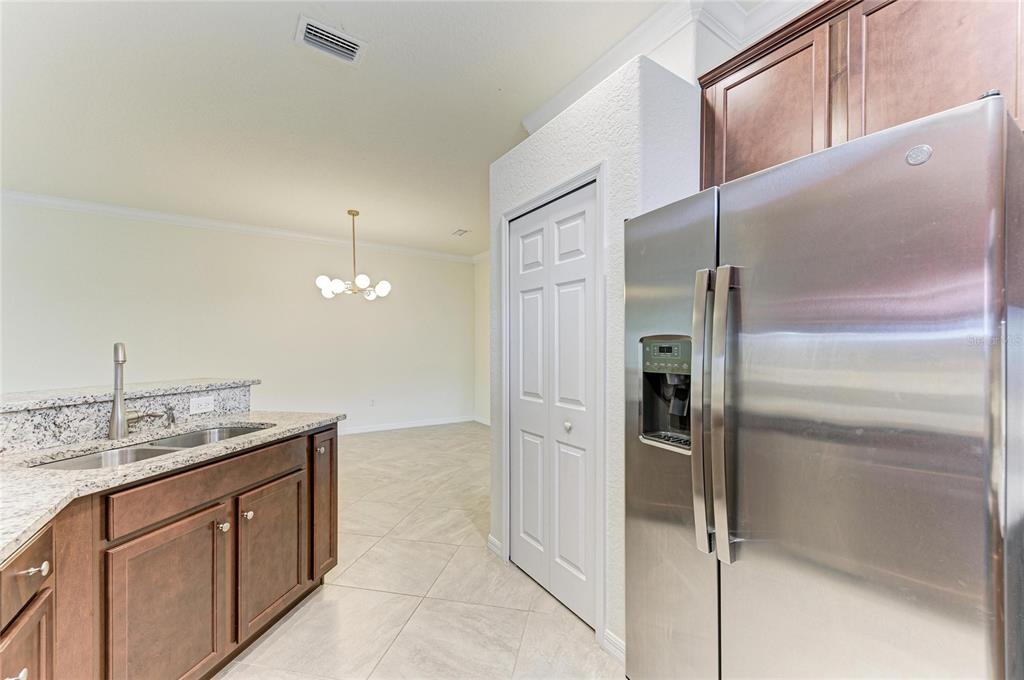 12434 Amica Loop Venice, FL 34293 - Photo 14 of 74 a bathroom with a granite countertop sink and a mirror