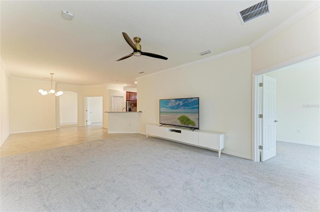 12434 Amica Loop Venice, FL 34293 - Photo 17 of 74 a view of an empty room with a fireplace