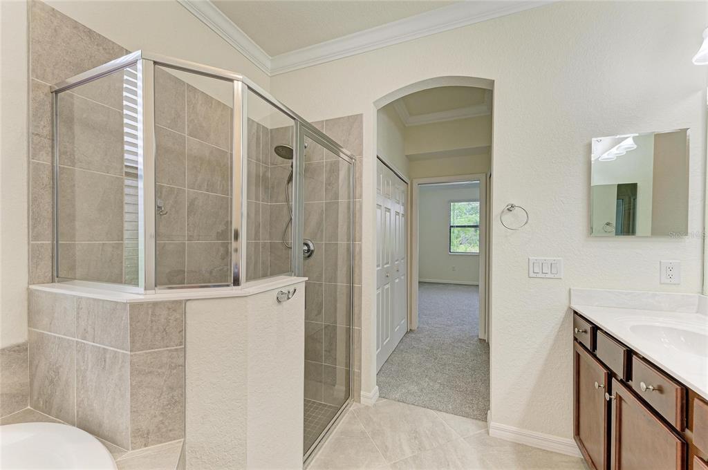 12434 Amica Loop Venice, FL 34293 - Photo 24 of 74 a bathroom with a shower and a sink
