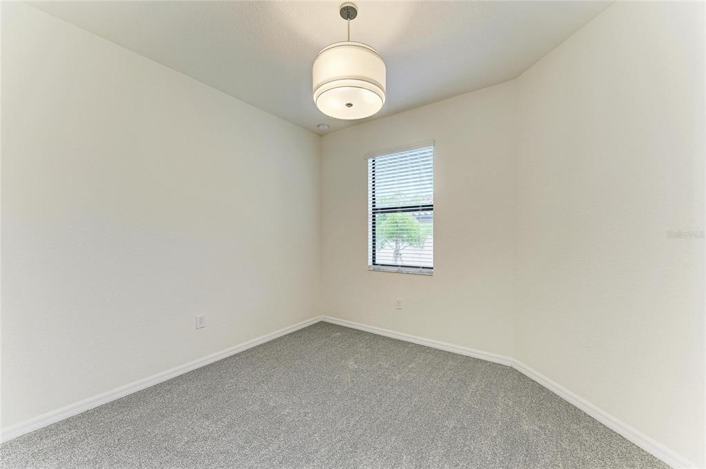 12434 Amica Loop Venice, FL 34293 - Photo 26 of 74 an empty room with a window