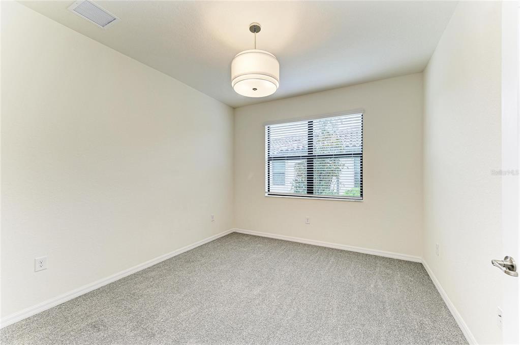 12434 Amica Loop Venice, FL 34293 - Photo 29 of 74 an empty room with a window