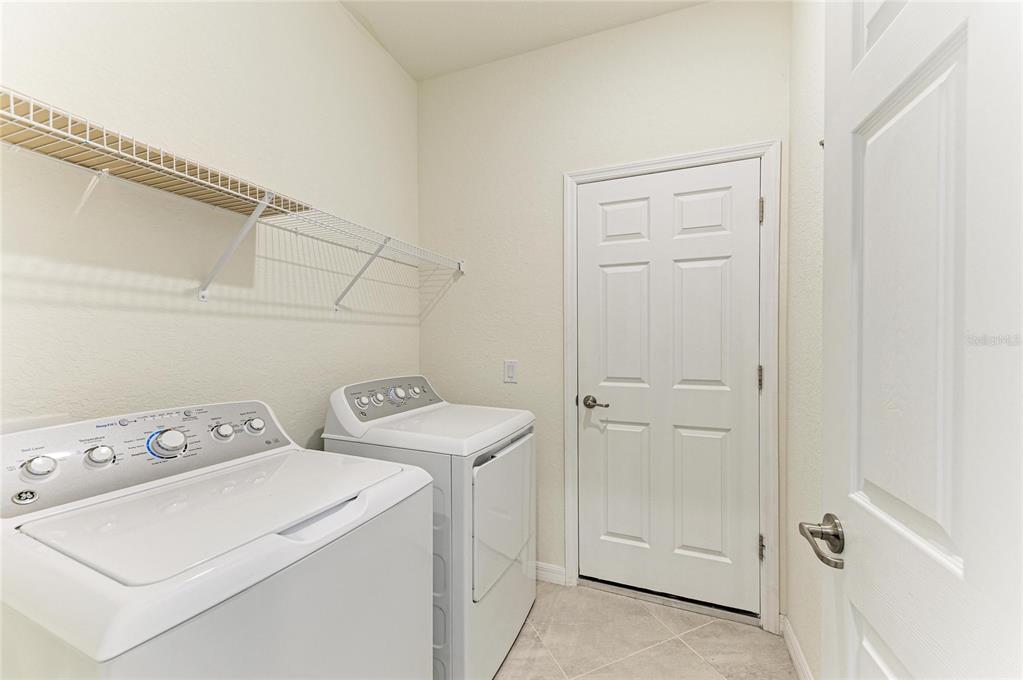 12434 Amica Loop Venice, FL 34293 - Photo 31 of 74 a view of utility room with washer and dryer