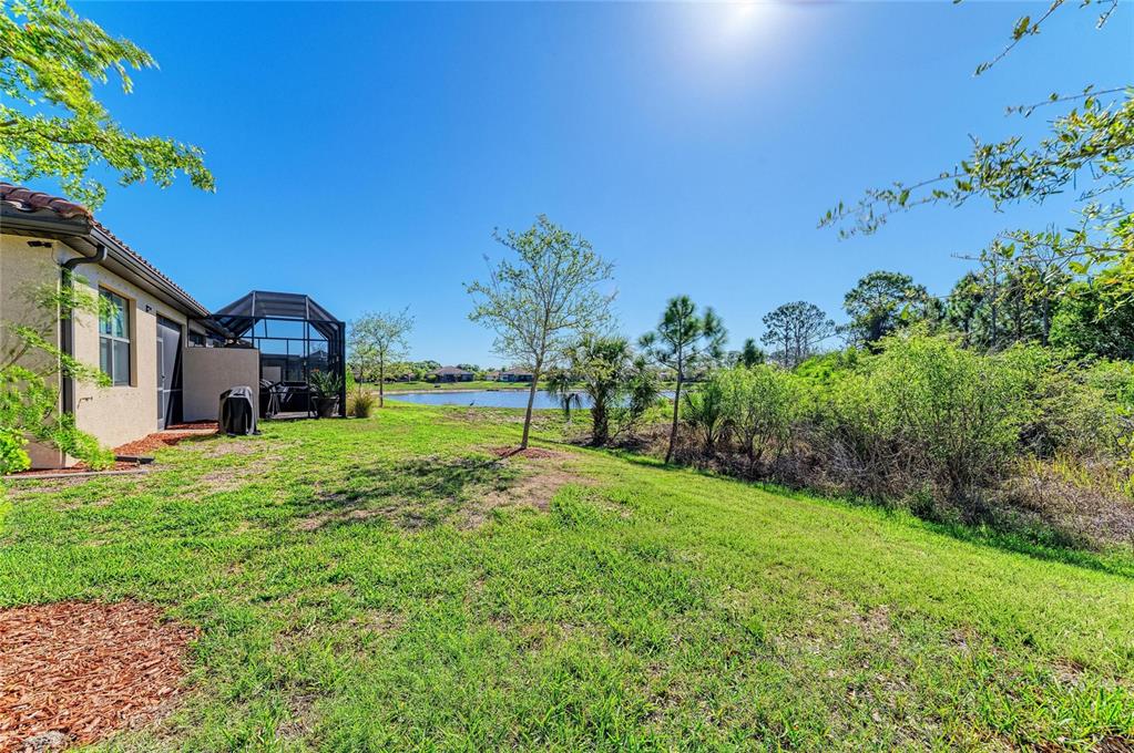 12434 Amica Loop Venice, FL 34293 - Photo 36 of 74 a view of a house with a big yard