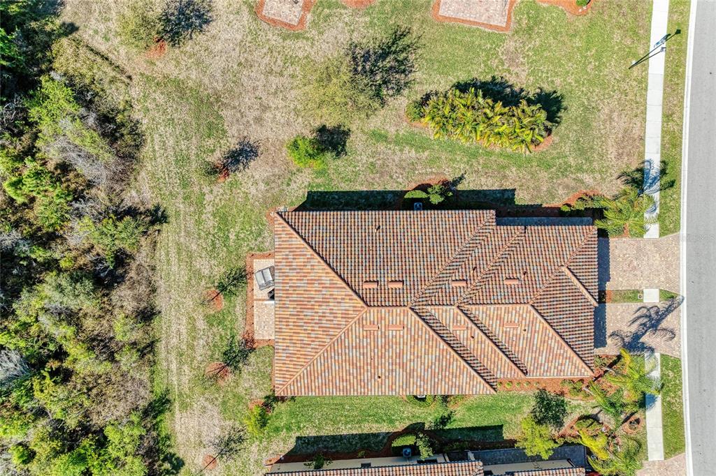 12434 Amica Loop Venice, FL 34293 - Photo 38 of 74 an aerial view of a house with a yard