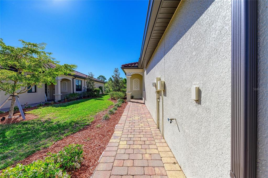 12434 Amica Loop Venice, FL 34293 - Photo 4 of 74 a front view of a house with a yard
