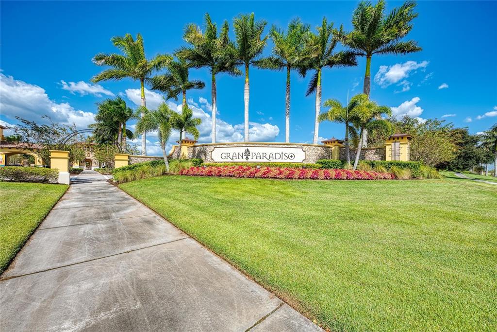 12434 Amica Loop Venice, FL 34293 - Photo 74 of 74 a front view of a house with a yard