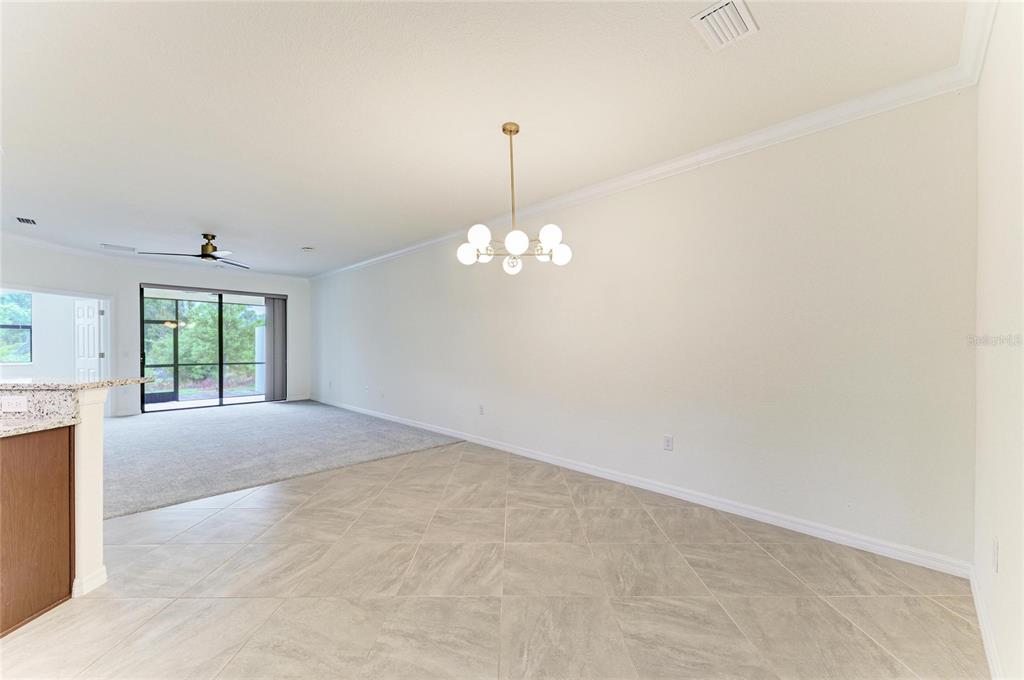 12434 Amica Loop Venice, FL 34293 - Photo 8 of 74 a view of empty room with window