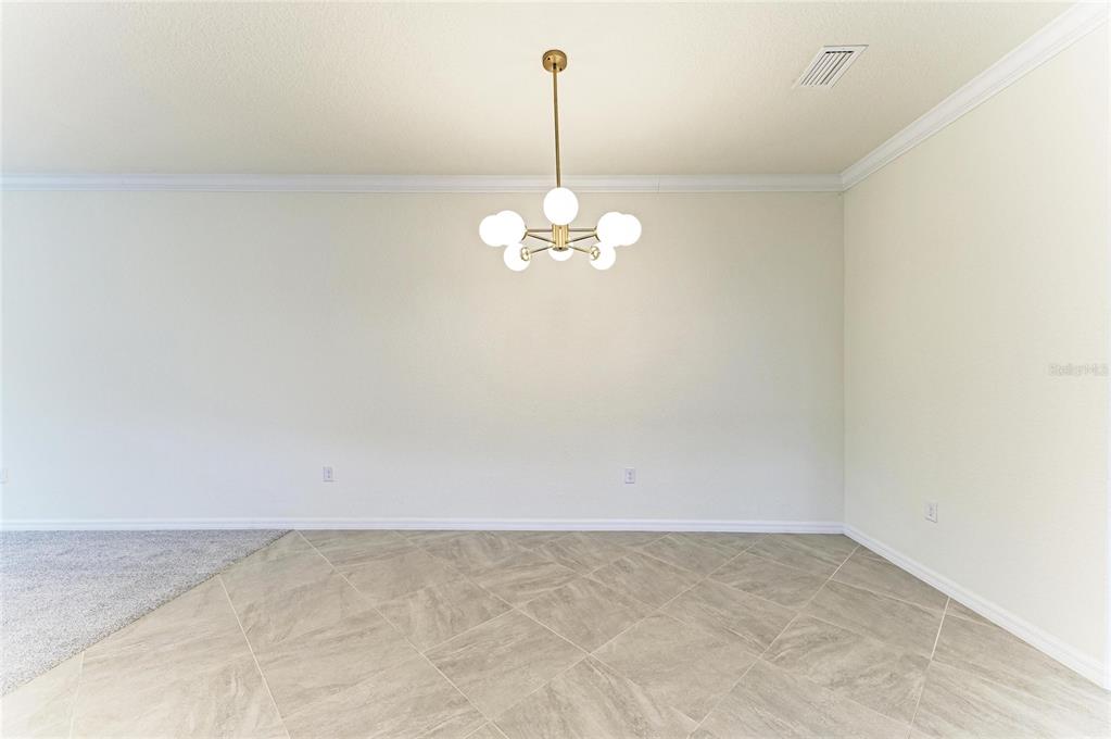 12434 Amica Loop Venice, FL 34293 - Photo 9 of 74 a view of a room with window and carpet