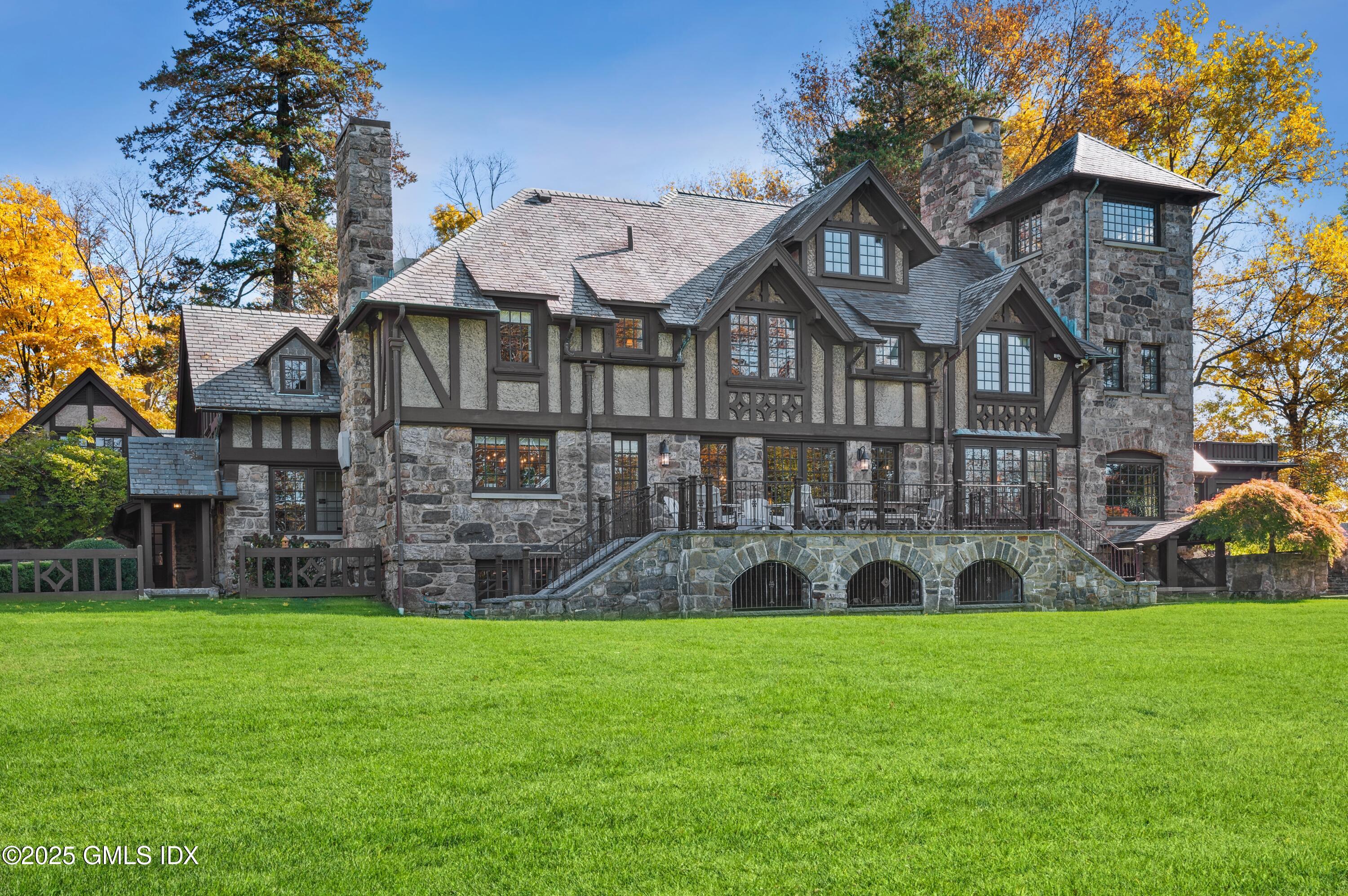 47 Carriglea Drive Riverside, CT 06878 - Photo 21 of 26 a front view of a house with a yard and green space