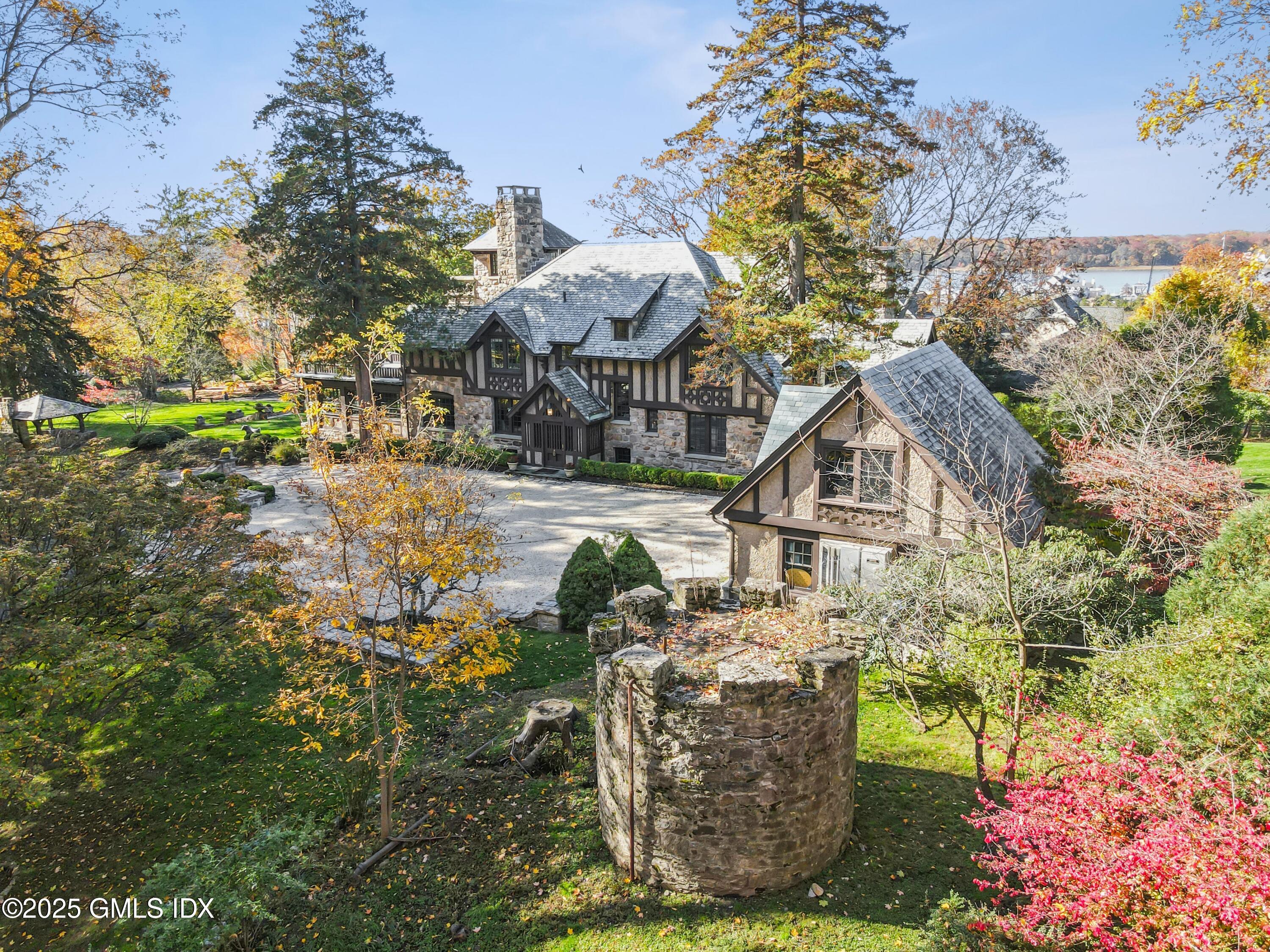 47 Carriglea Drive Riverside, CT 06878 - Photo 25 of 26 a view of a house with a yard and garden