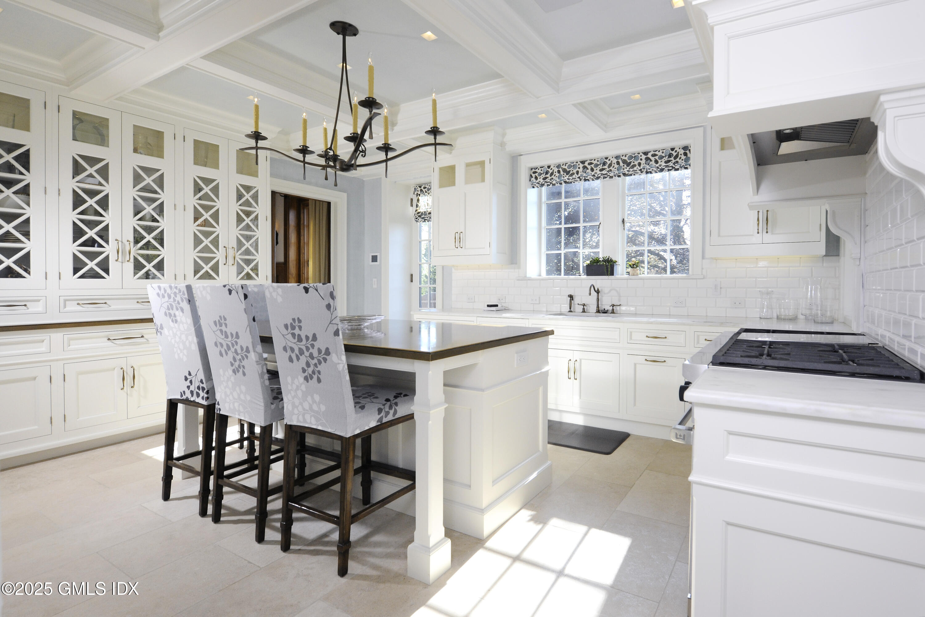 47 Carriglea Drive Riverside, CT 06878 - Photo 7 of 26 a kitchen that has a dining table chairs stainless steel appliances and cabinets