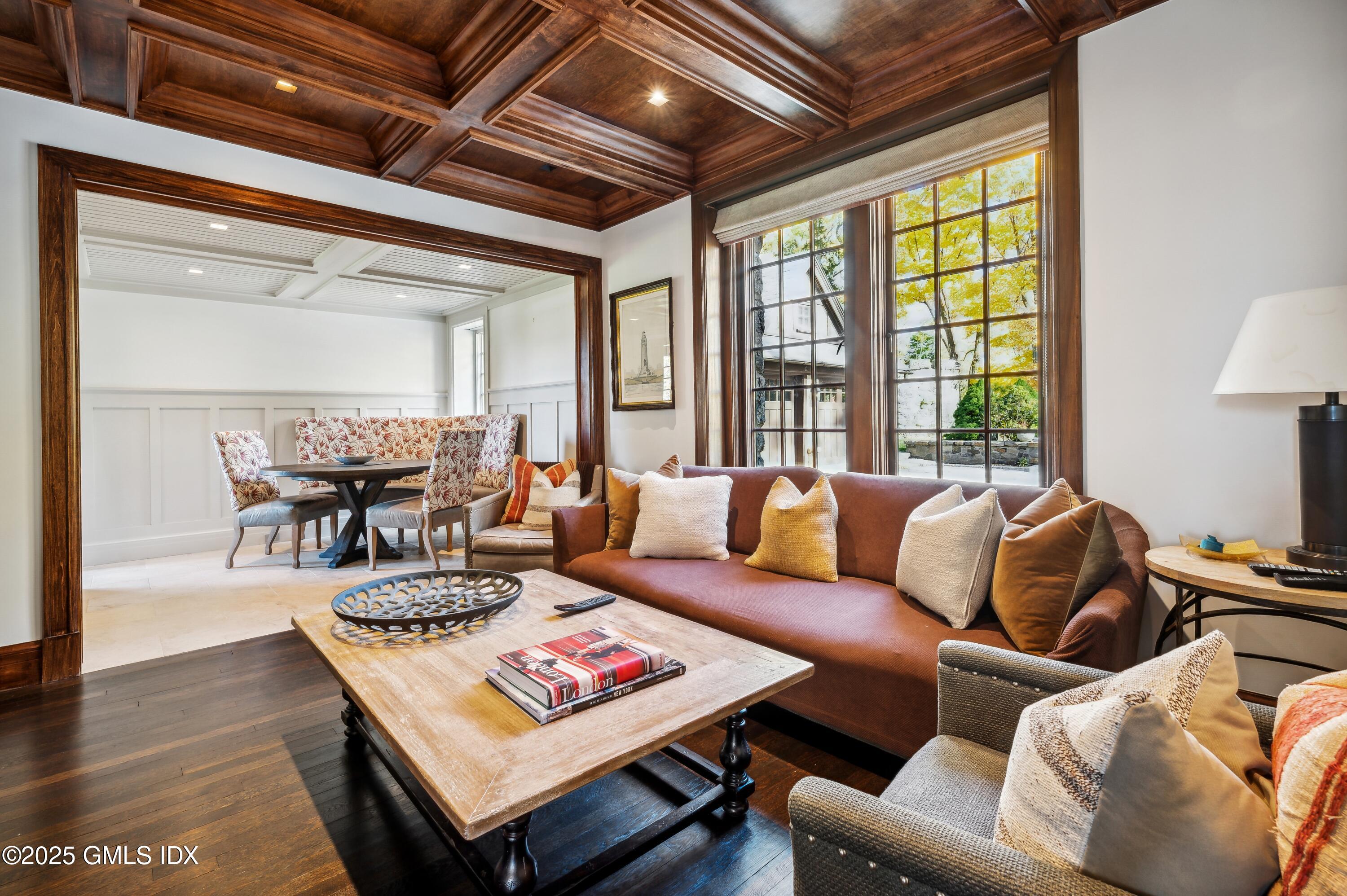 47 Carriglea Drive Riverside, CT 06878 - Photo 9 of 26 a living room with furniture a table and a large window
