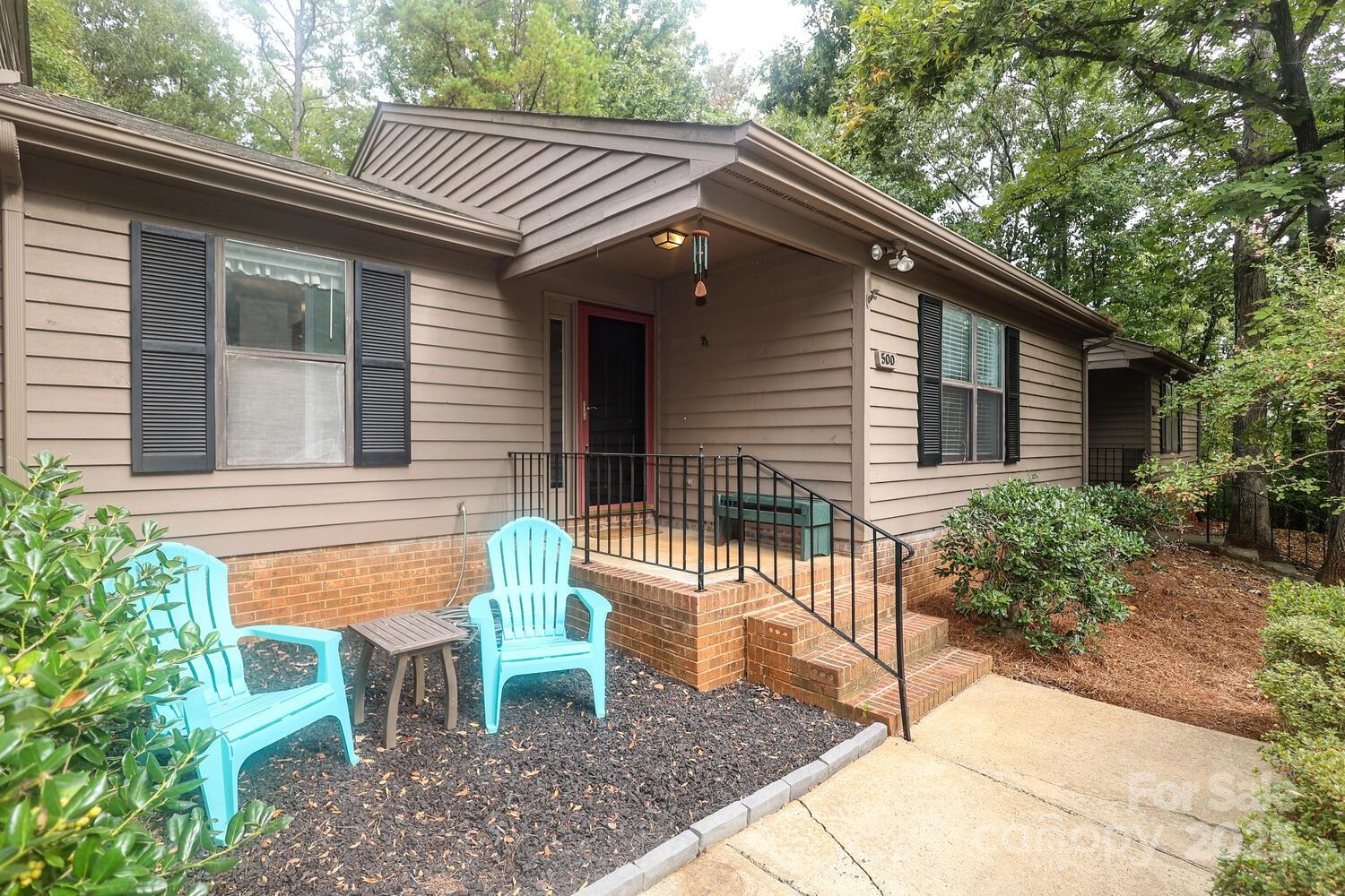 500 Sweetgum Drive, Unit 48C Fort Mill, SC 29715 - Photo 1 of 40 a front view of a house with a garden