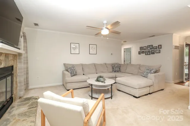 a living room with furniture a fireplace