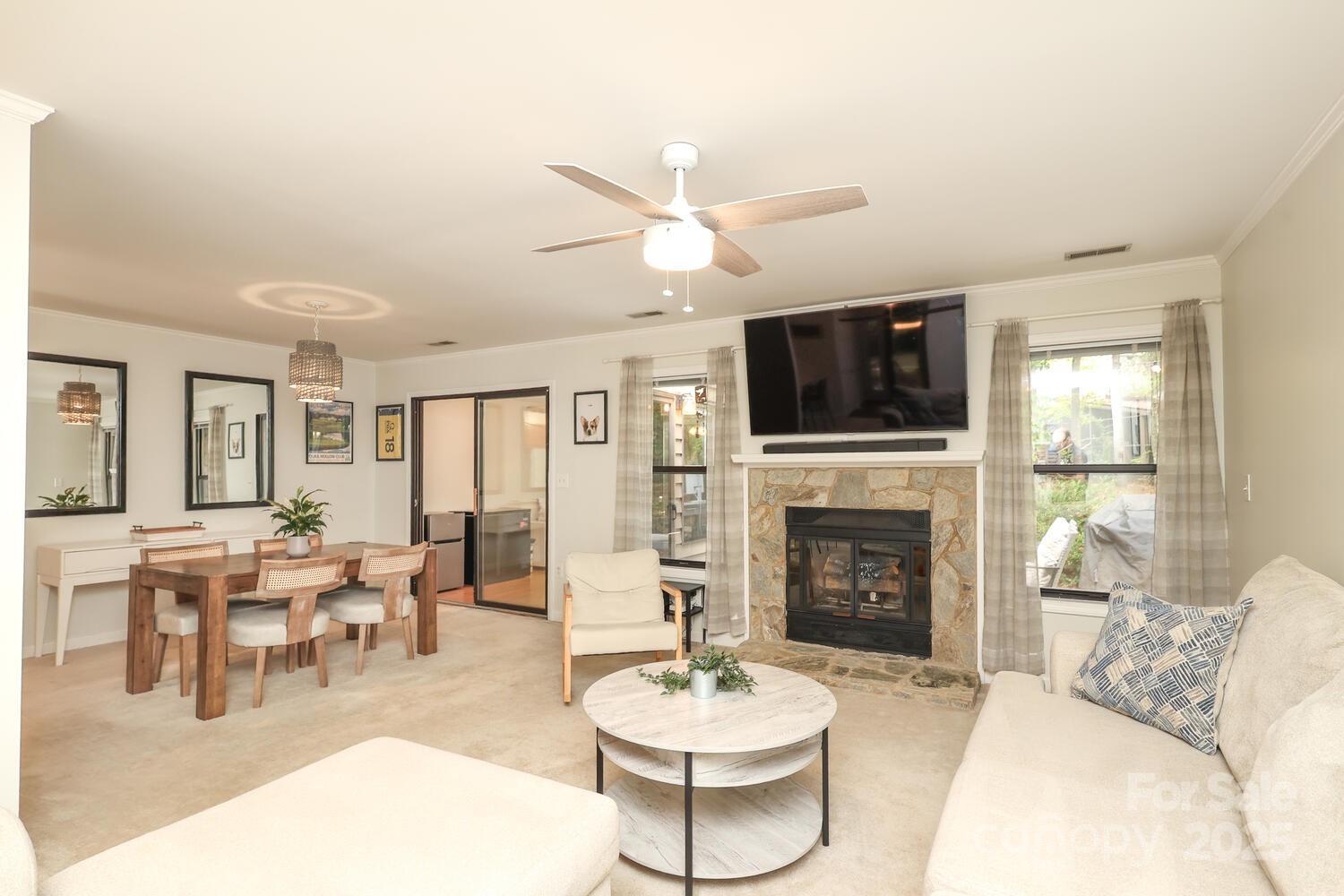 500 Sweetgum Drive, Unit 48C Fort Mill, SC 29715 - Photo 14 of 40 a living room with furniture a fireplace and a flat screen tv