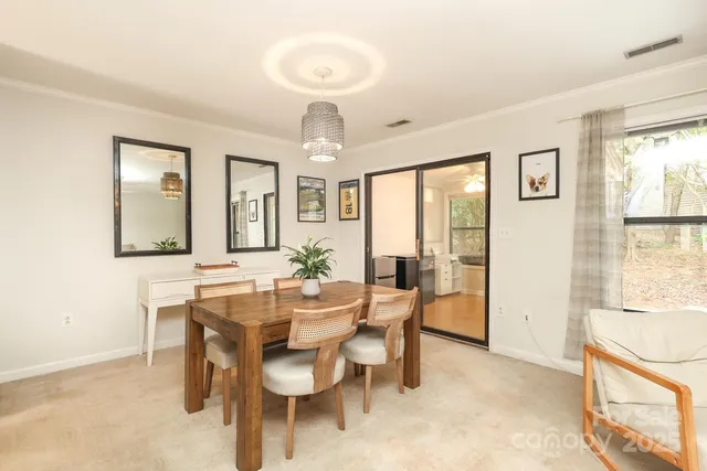 a view of a dining room with furniture window and outside view