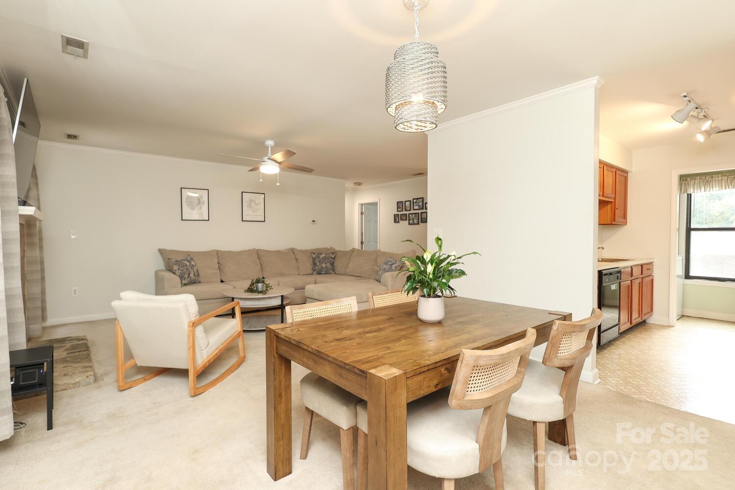 500 Sweetgum Drive, Unit 48C Fort Mill, SC 29715 - Photo 21 of 40 a living room with dining table and chairs