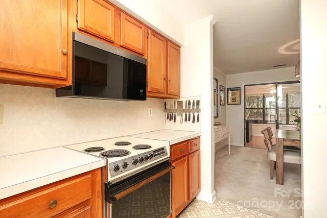 a kitchen with a stove and a microwave