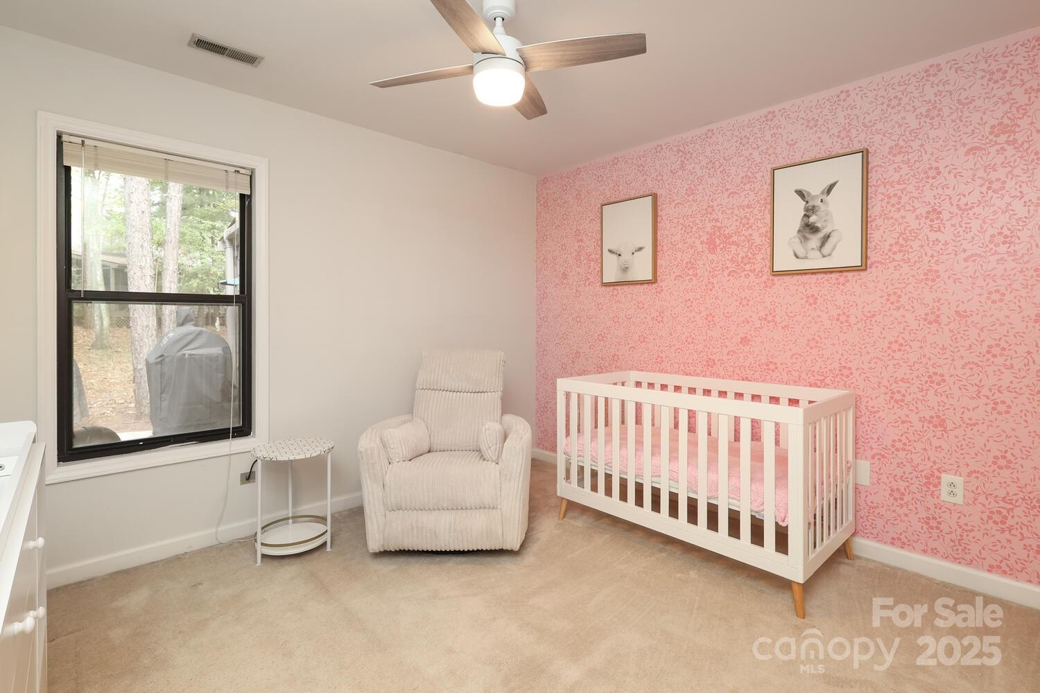 500 Sweetgum Drive, Unit 48C Fort Mill, SC 29715 - Photo 29 of 40 a white bed sitting in a room next to a window