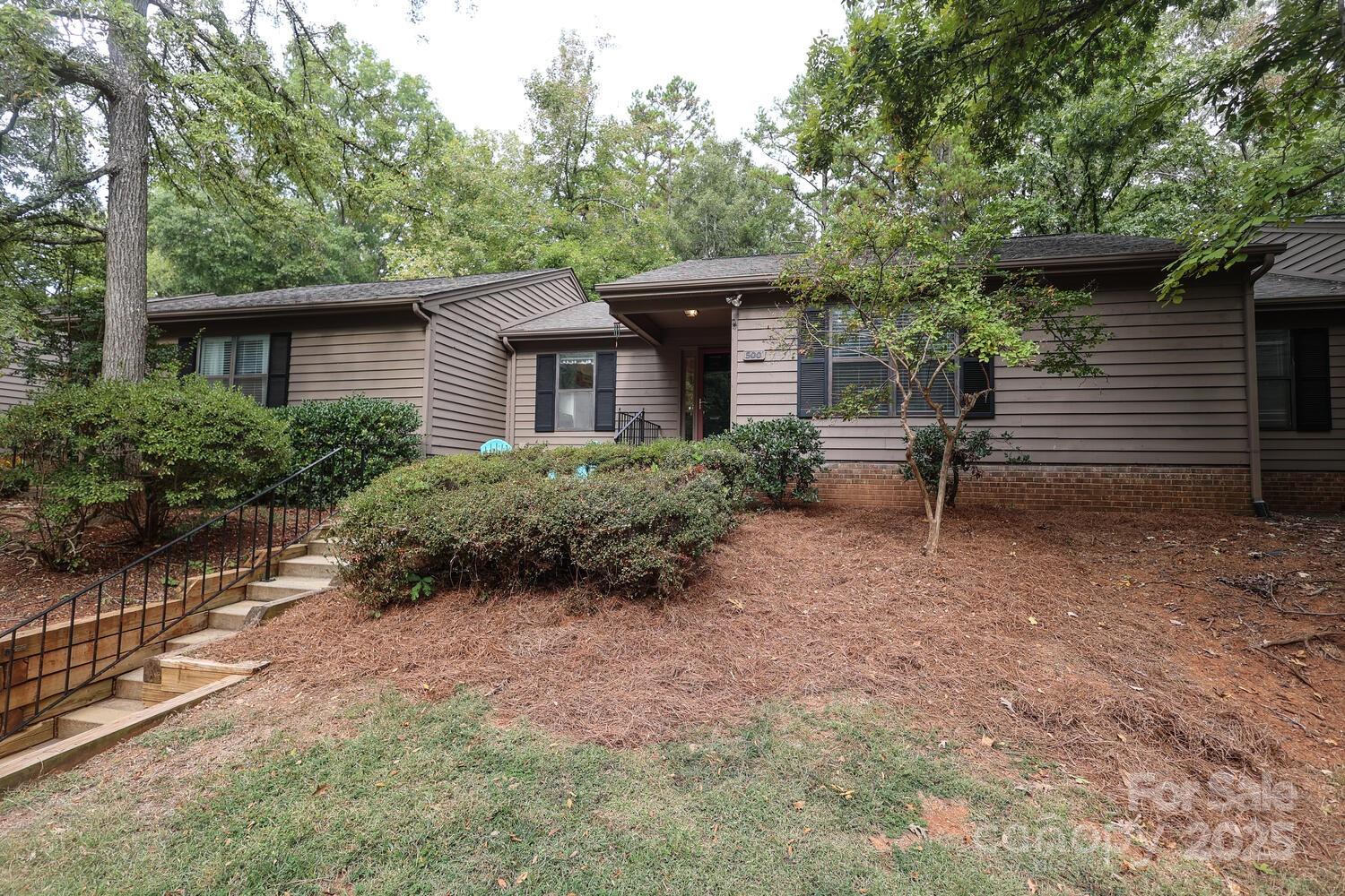 500 Sweetgum Drive, Unit 48C Fort Mill, SC 29715 - Photo 3 of 40 a view of backyard of house with green space