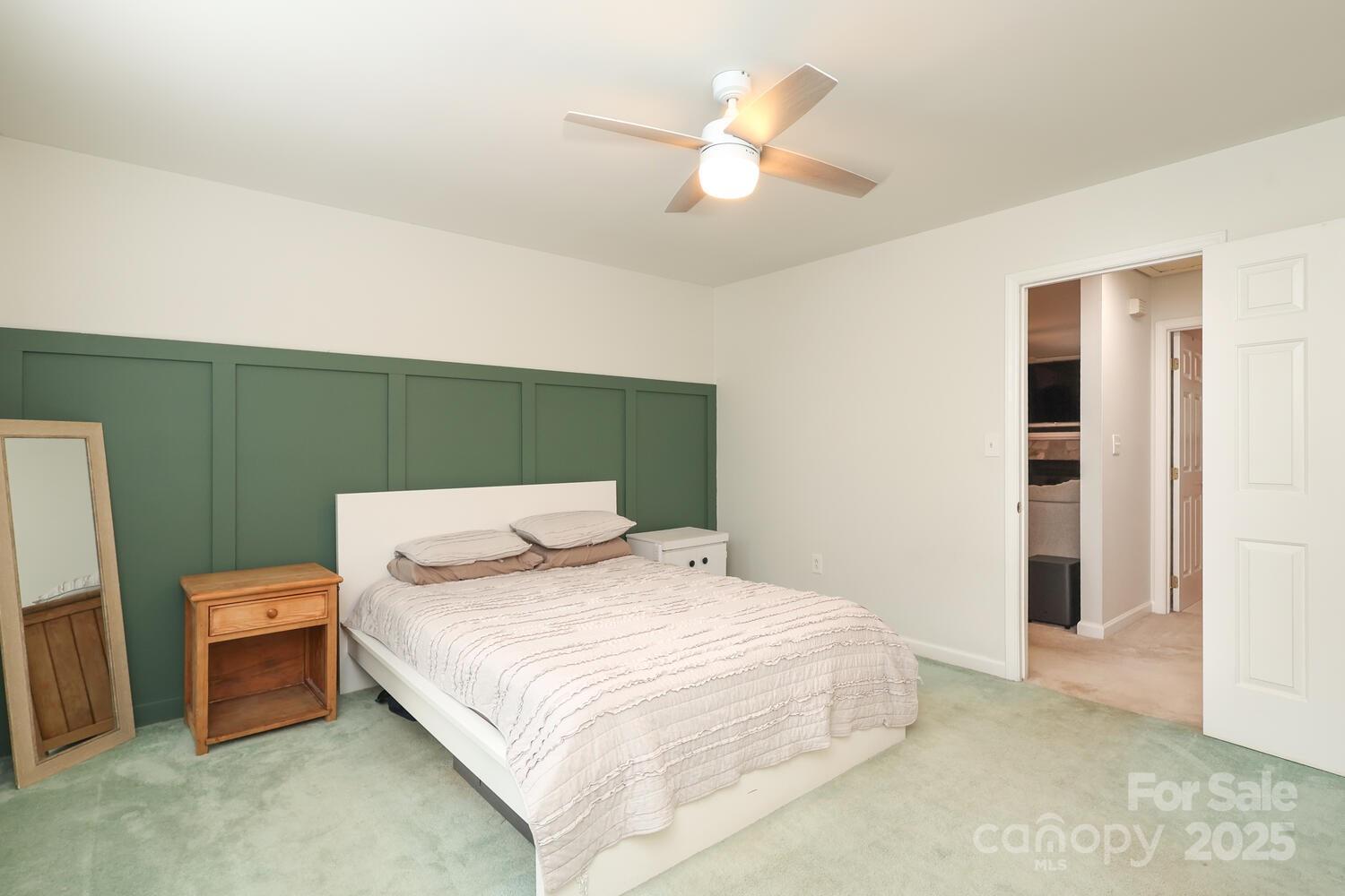 500 Sweetgum Drive, Unit 48C Fort Mill, SC 29715 - Photo 33 of 40 a bedroom with a bed and a chandelier