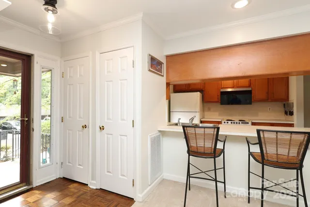 a view of a livingroom with furniture and a flat screen tv