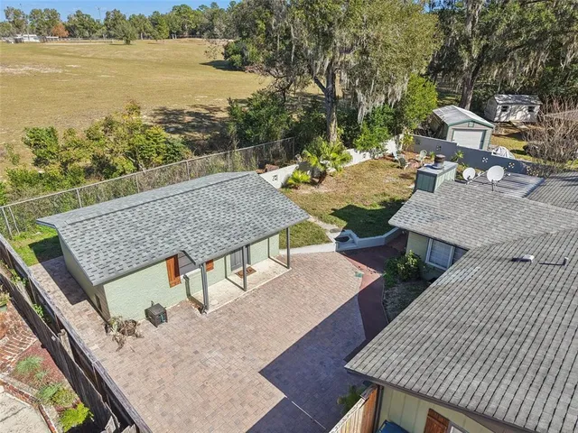 an outdoor space with furniture and city view