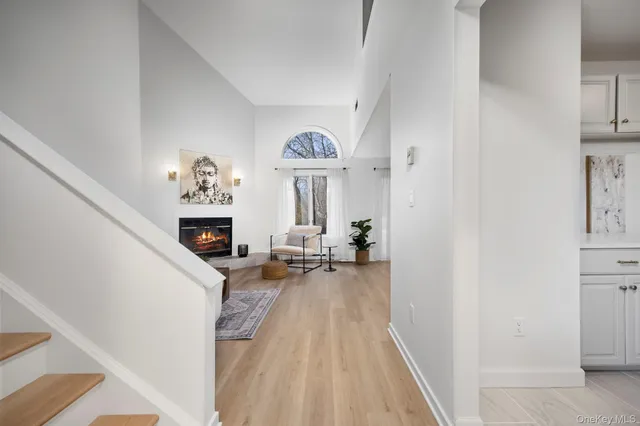 a view of living room with furniture and fireplace