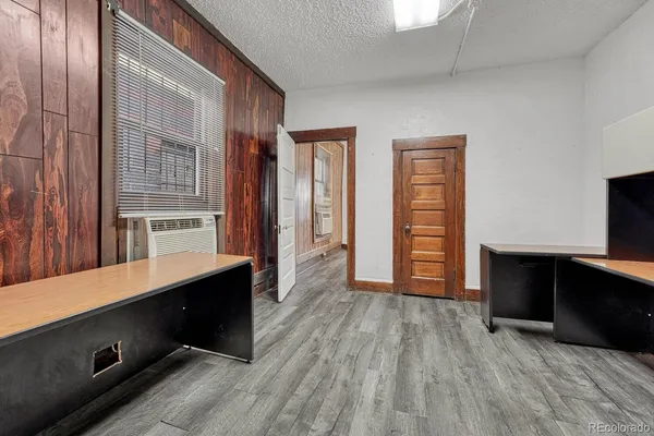 a room with a stove and a refrigerator