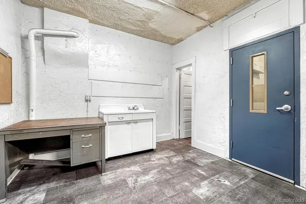 a white toilet sitting next to a small bathroom