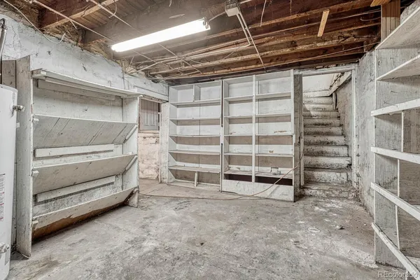 a view of an empty room with a brick wall