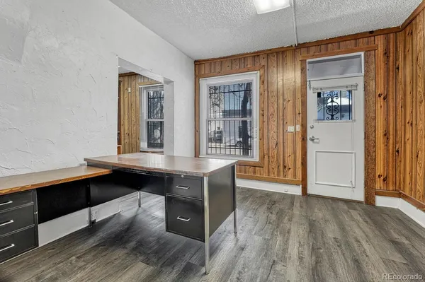 a view of room with window and wooden floor