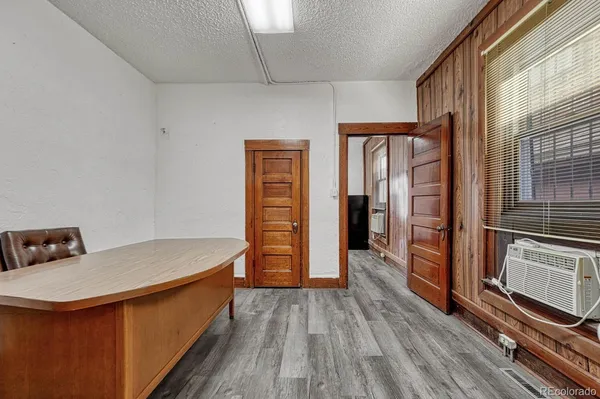 a kitchen with white cabinets and sink