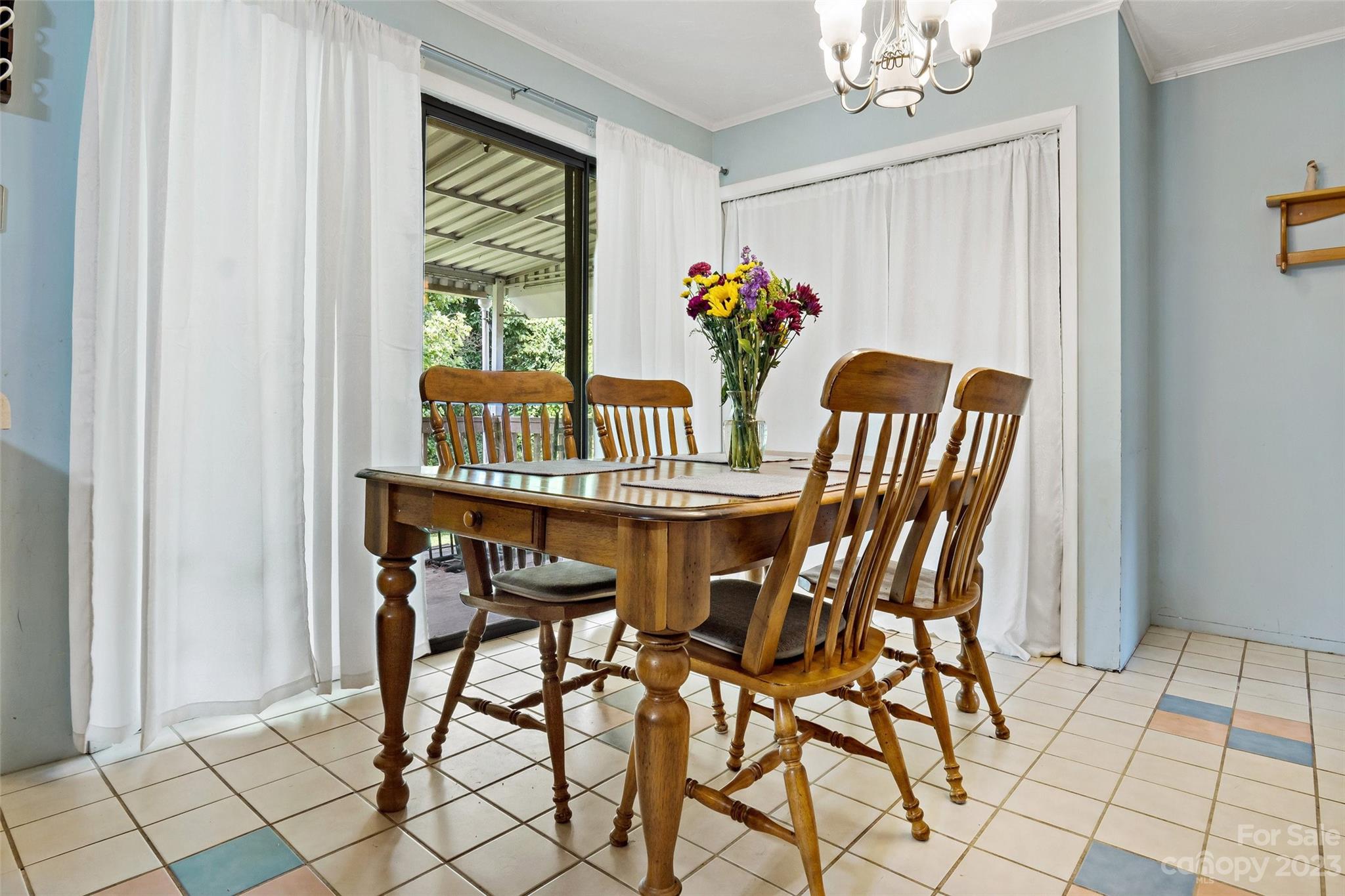 5232 Bat Cave Road Old Fort, NC 28762 - Photo 11 of 32 a view of a dining room with furniture window and outside view