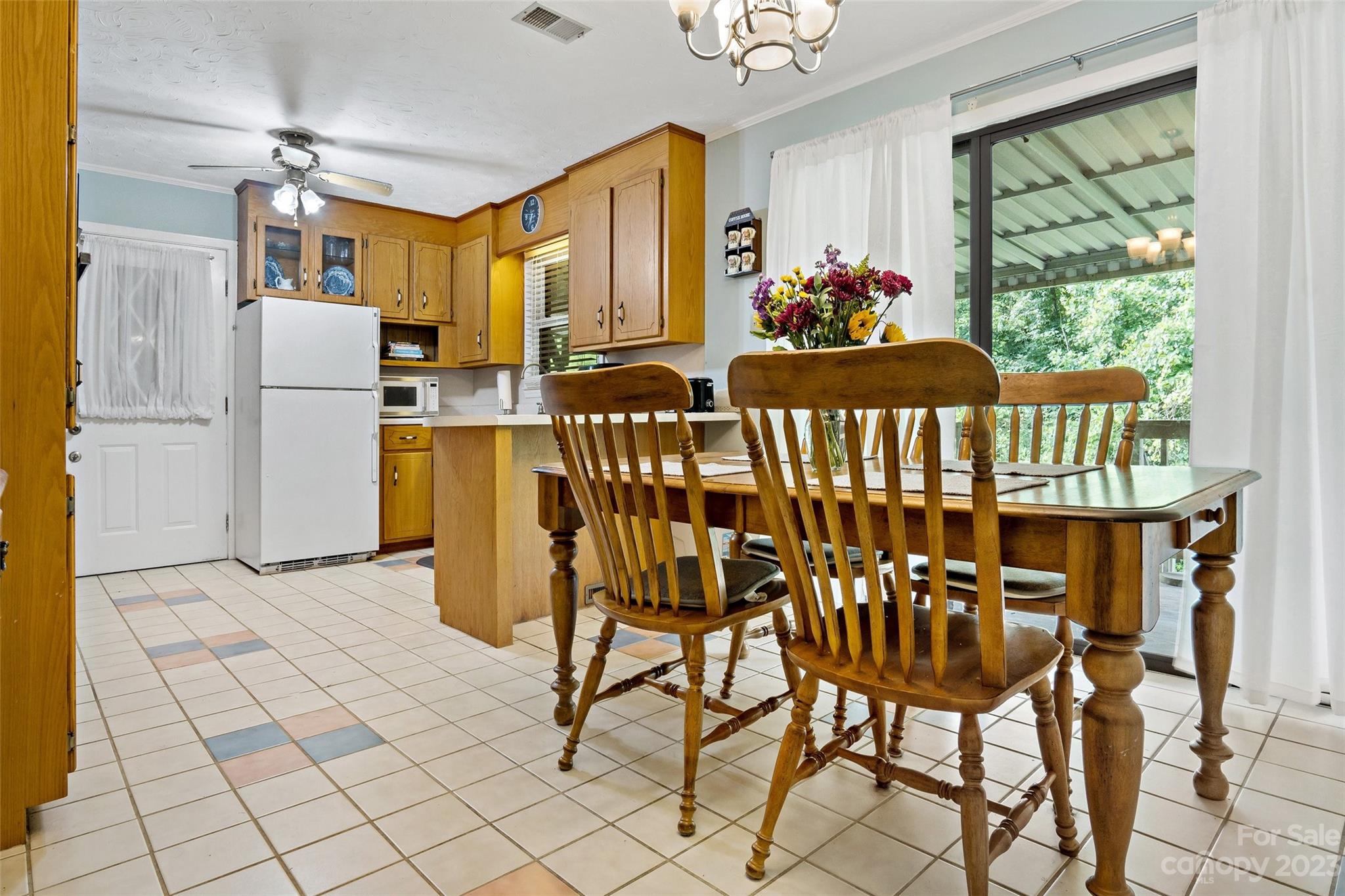5232 Bat Cave Road Old Fort, NC 28762 - Photo 12 of 32 a dining room with furniture and a window