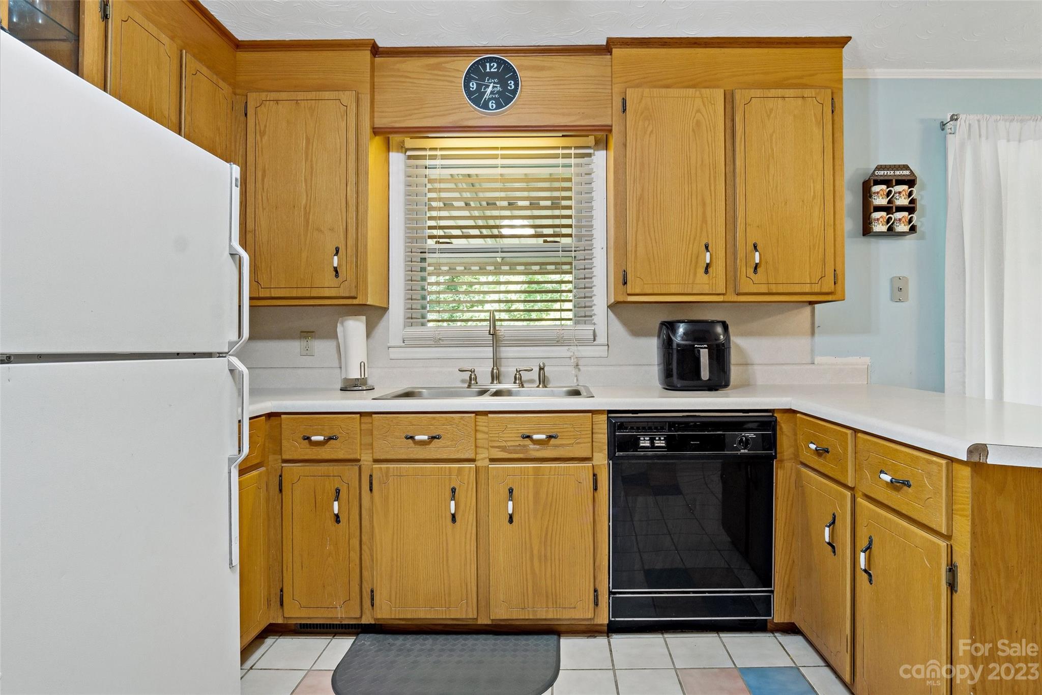 5232 Bat Cave Road Old Fort, NC 28762 - Photo 16 of 32 a kitchen with granite countertop cabinets stainless steel appliances a sink and a window