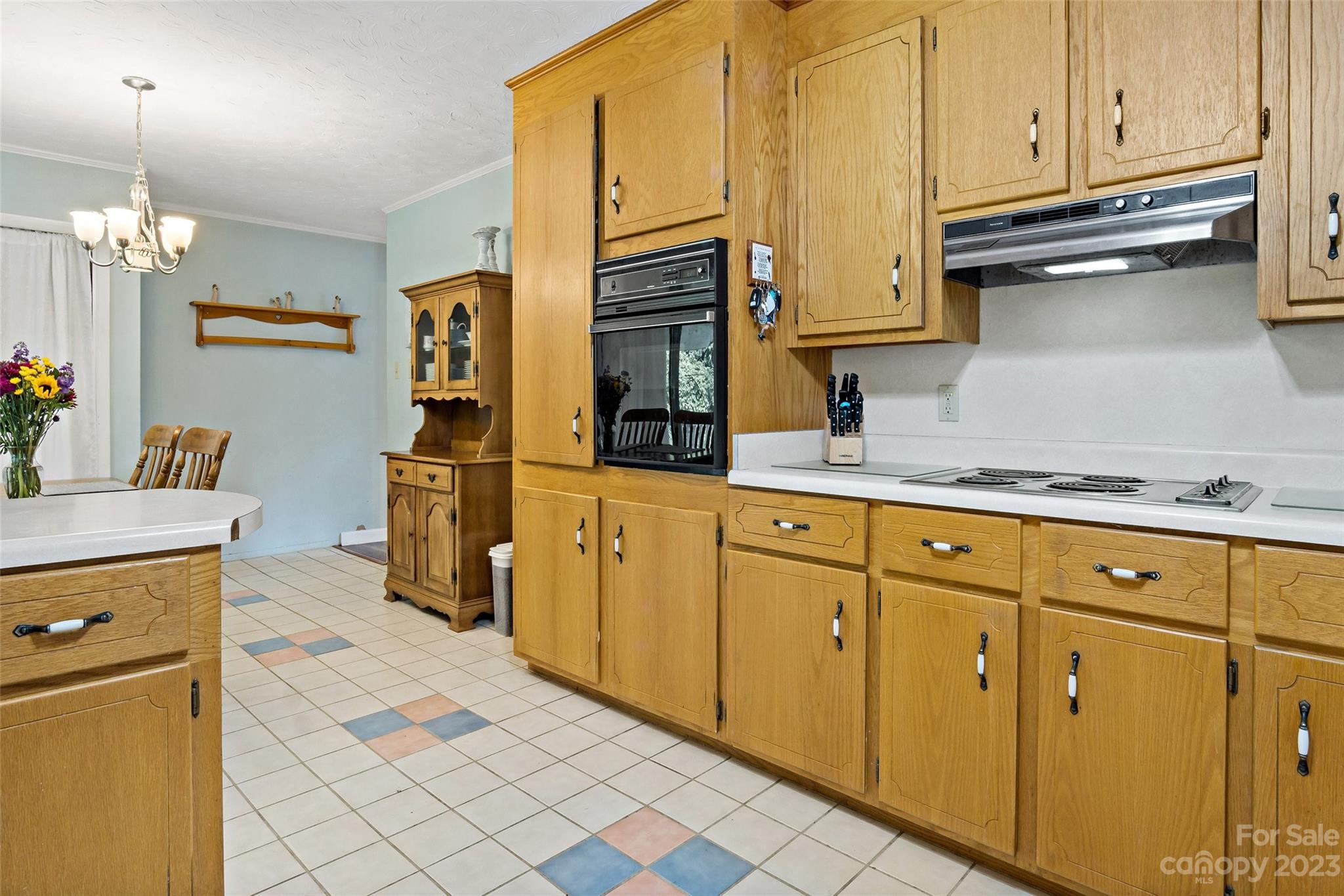5232 Bat Cave Road Old Fort, NC 28762 - Photo 18 of 32 a kitchen with stainless steel appliances granite countertop a refrigerator and cabinets
