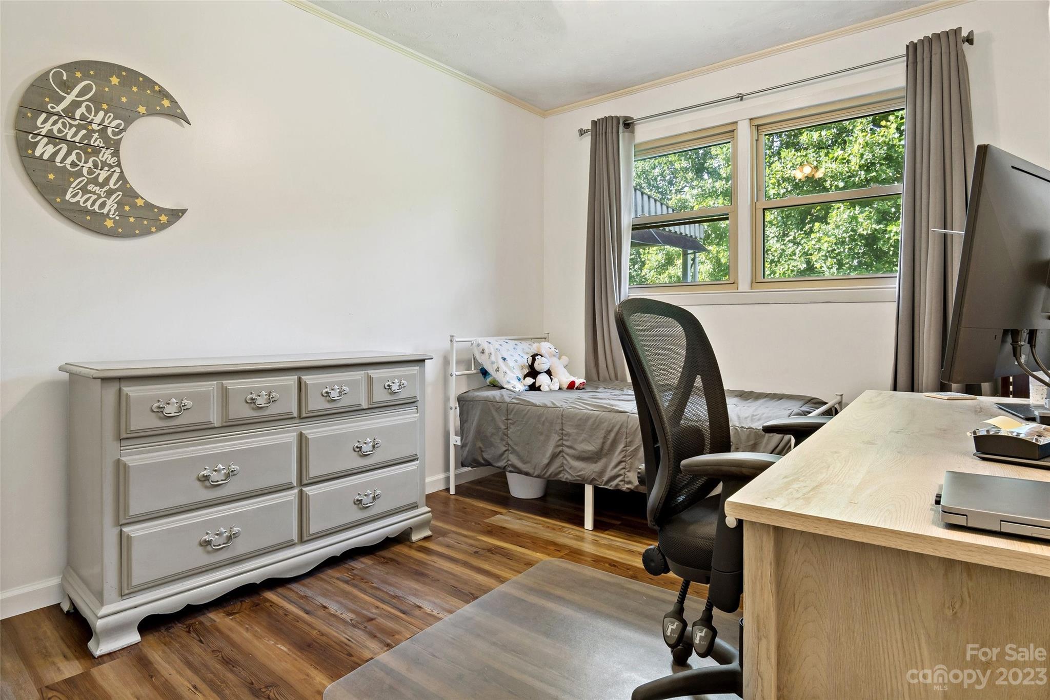 5232 Bat Cave Road Old Fort, NC 28762 - Photo 19 of 32 a bedroom with a bed and a window