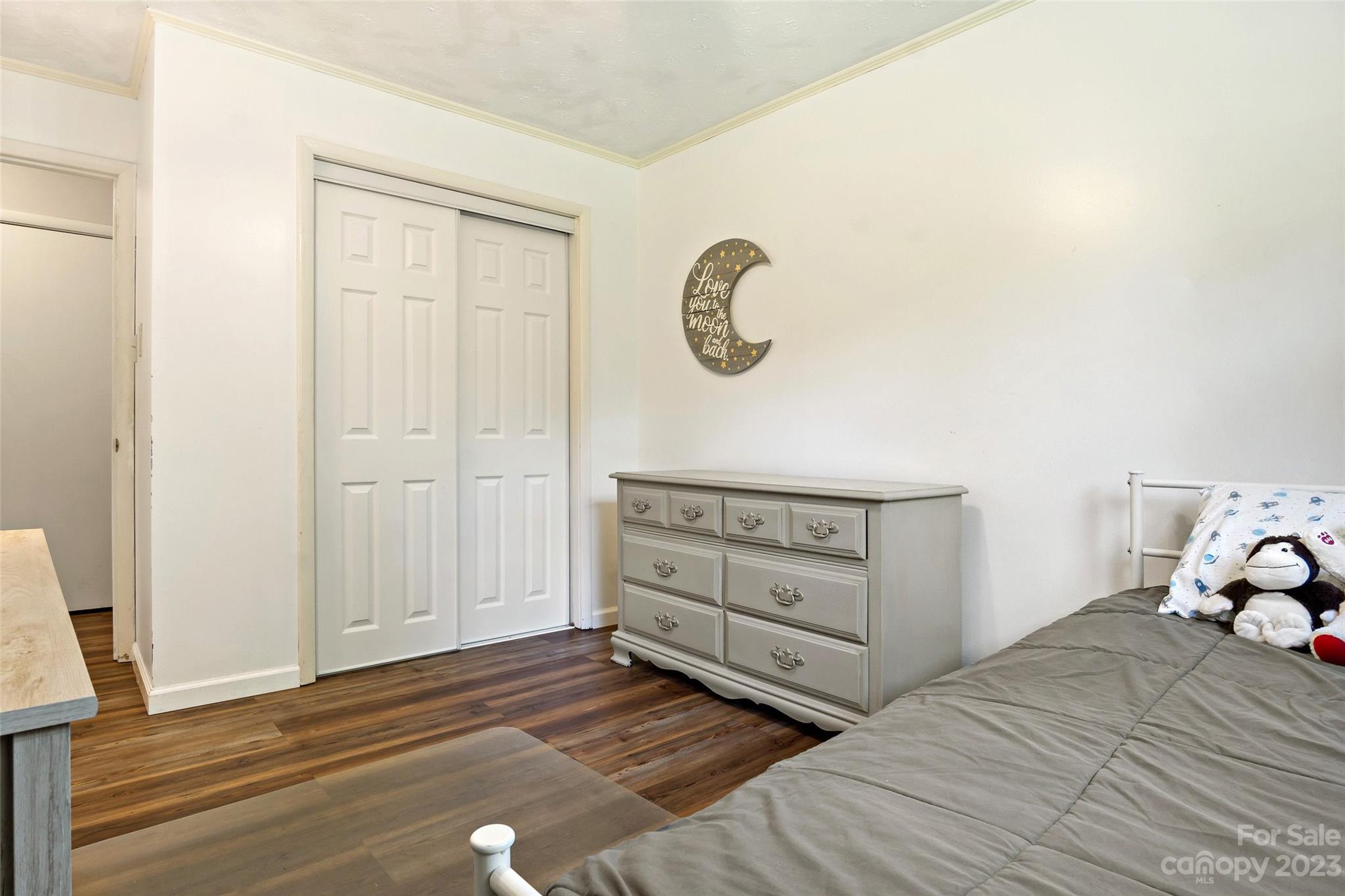 5232 Bat Cave Road Old Fort, NC 28762 - Photo 21 of 32 a bedroom with a bed and a dresser
