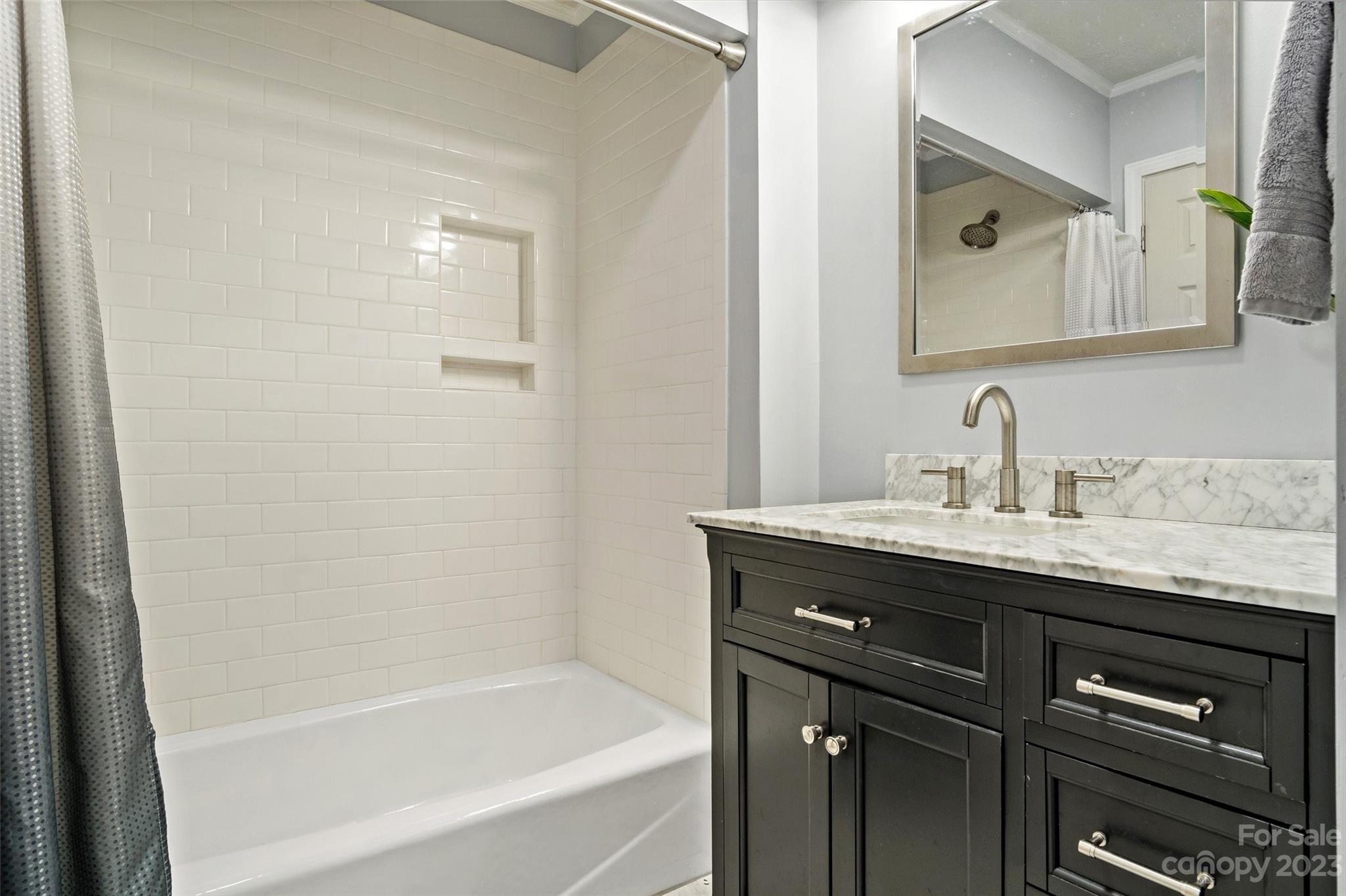 5232 Bat Cave Road Old Fort, NC 28762 - Photo 22 of 32 a bathroom with a granite countertop sink mirror and a