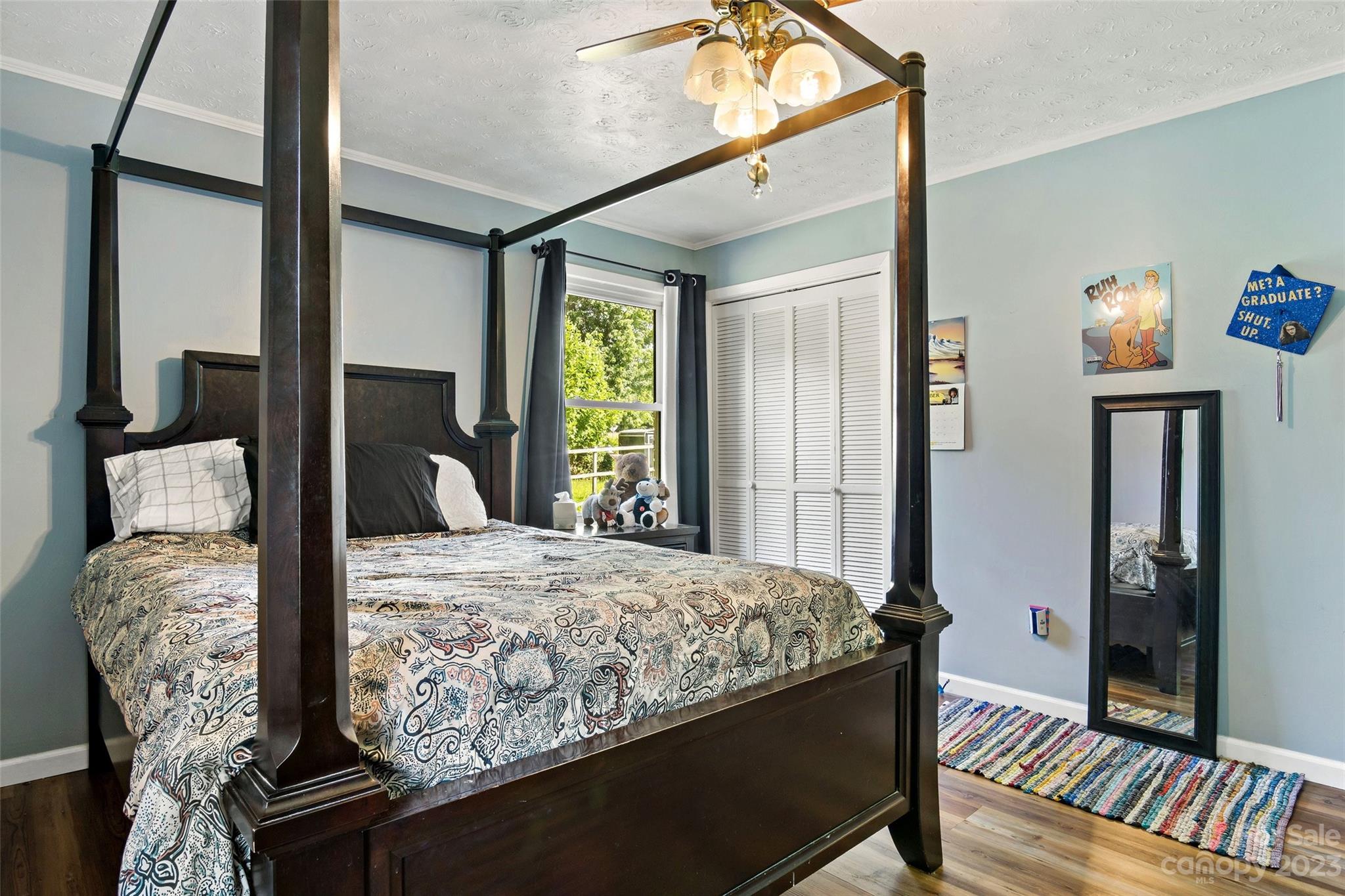 5232 Bat Cave Road Old Fort, NC 28762 - Photo 26 of 32 a bedroom with bed and window